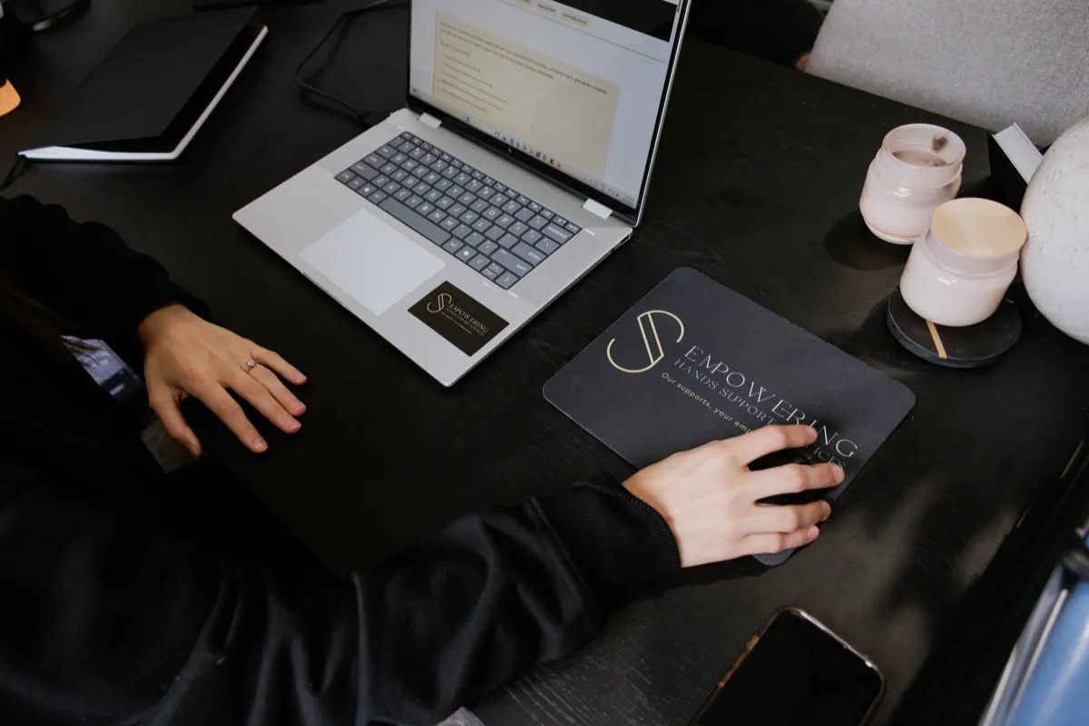 Participant and support worker in community setting, choosing activity together