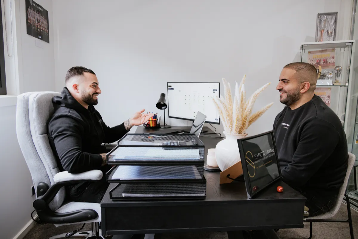 Support worker arriving at participant's home, professional and welcoming