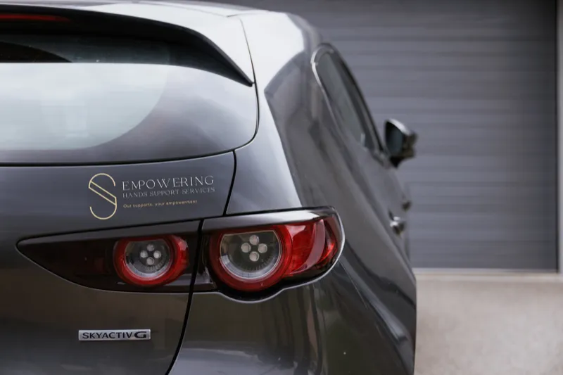 Participant and support worker engaging in community activity